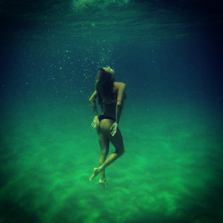 Girls under water without air and clothes