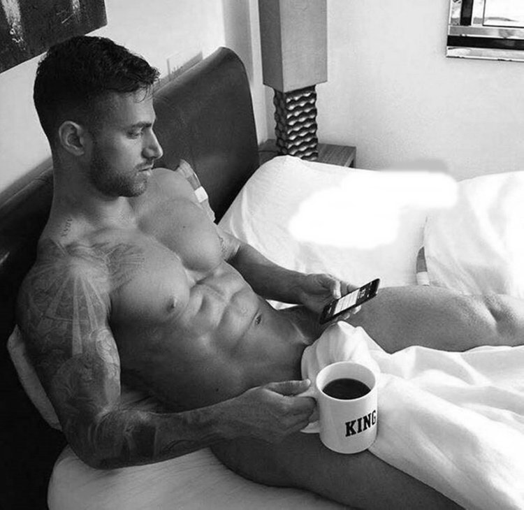 Naked man with a cup of coffee