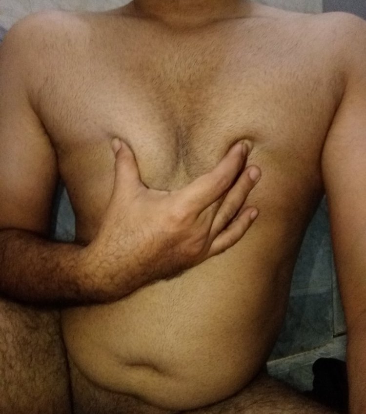 The guy squeezes men's nipples
