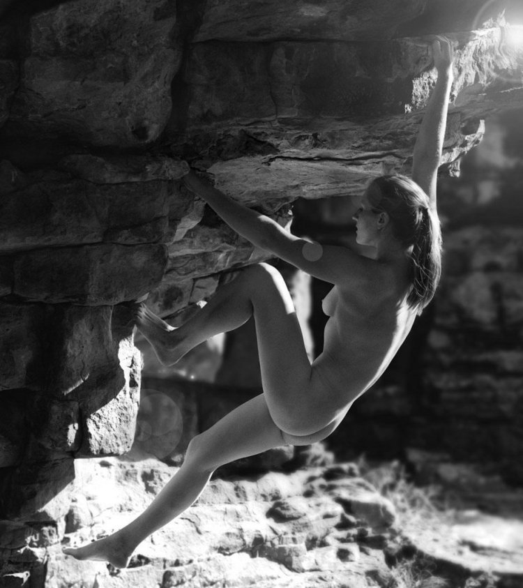 He is engaged in climbing naked