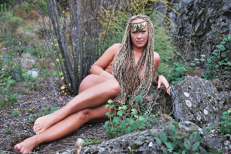 Naked with dreadlocks in nature