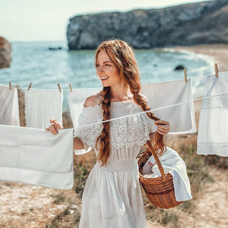 Girl with lamb on her arms