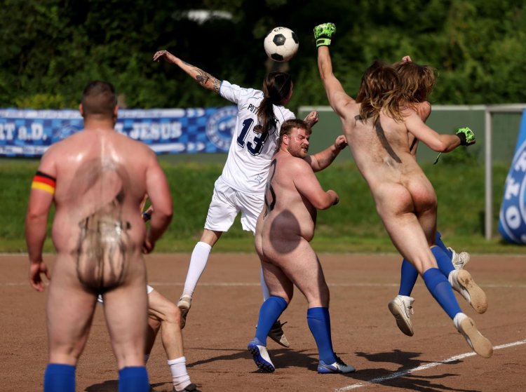 Naked woman on a football field