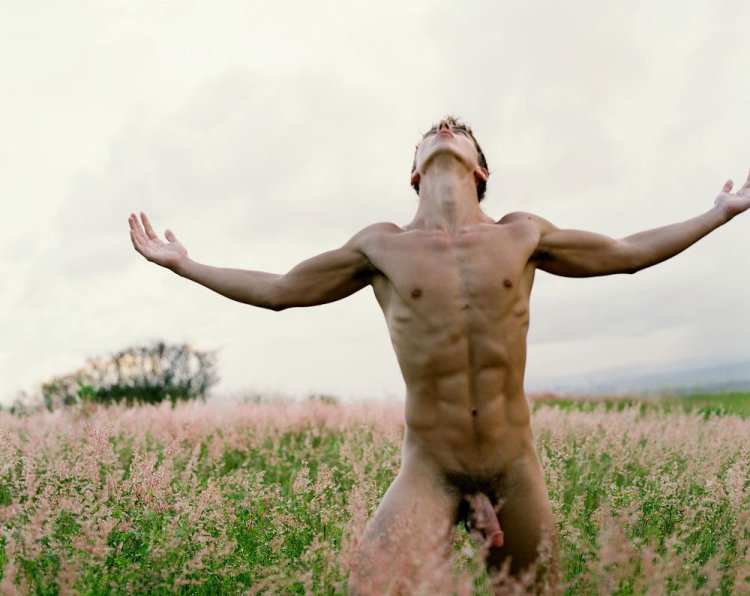 Naked guy by a naked tree