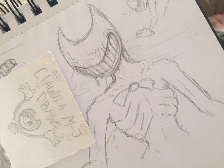Sketches of Bendy with a pen