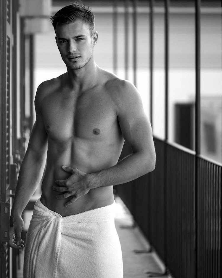 Muscular man on the bed